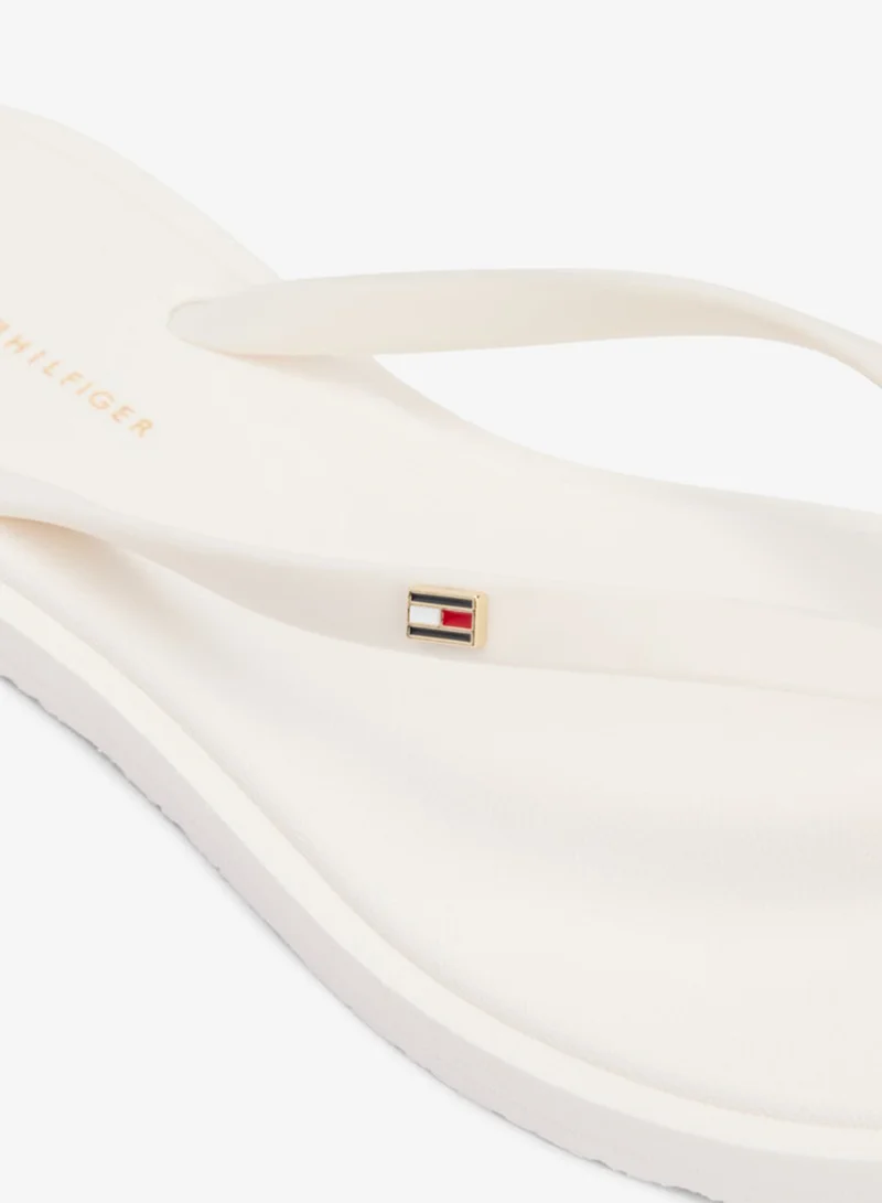 TOMMY HILFIGER  Chic Enamel Flag Flip-Flops for Women | Best Price UAE